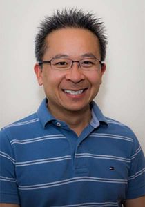 Dr-Nghi-Huynh in a collared blue shirt
